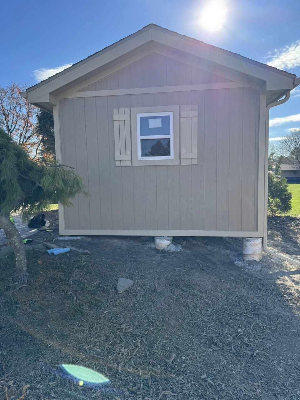 Custom outbuilding — side view with new siding